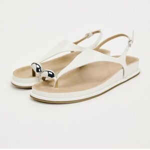 Zara. NWOT Flat leather sandals with toe post and metal trim.Size 9.5